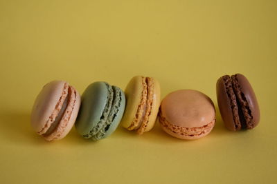 Close-up of candies against yellow background