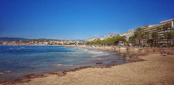 Scenic view of beach against clear sky