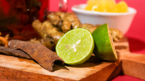 High angle view of fruits and leaves on table