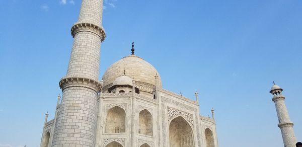 Low angle view of historical building against blue sky