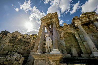 Low angle view of historic temple against sky