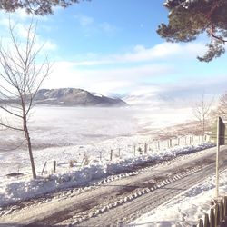 Scenic view of frozen landscape against sky