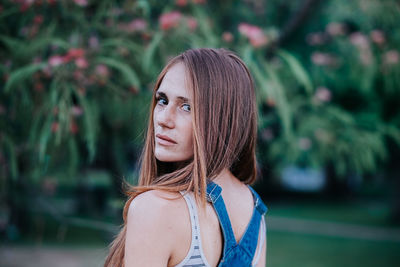 Portrait of woman against trees