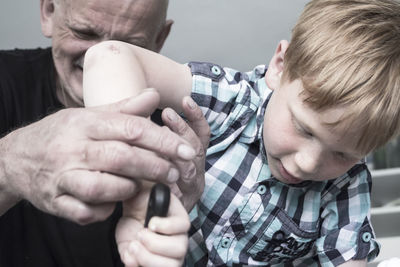 Close-up of boy with grandfather