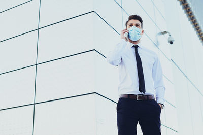 Man standing against wall