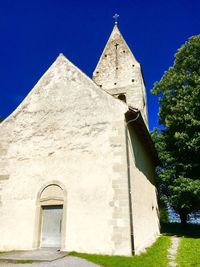 Low angle view of church against blue sky