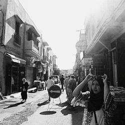 Woman standing on city street