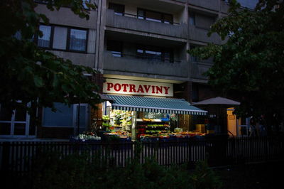 Information sign in city at night