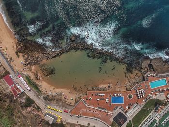 High angle view of buildings by sea