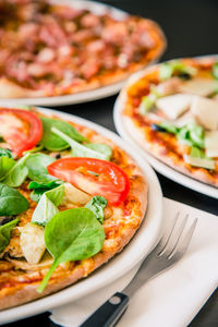 Close-up of pizza served on table