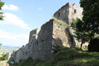 Low angle view of historic building against sky