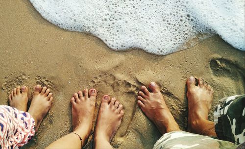 Low section of people on beach