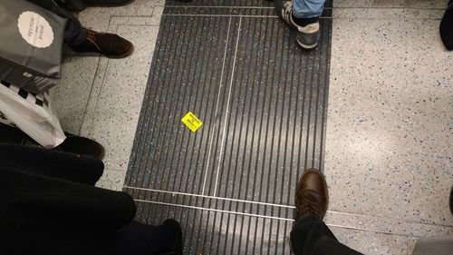 Low section of men sitting in bus