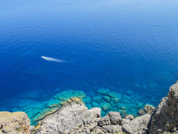 High angle view of boat sailing in sea