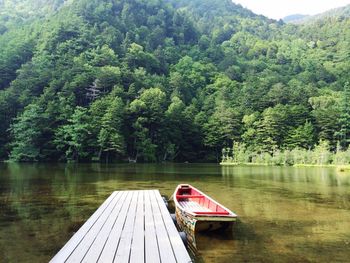 Scenic view of boat sailing in river