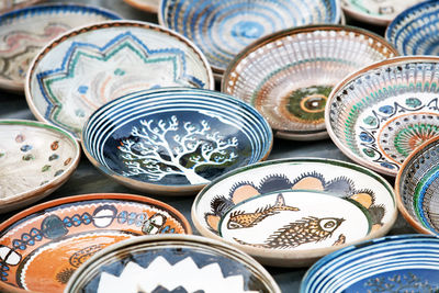High angle view of romanian traditional ceramic plates for sale at market