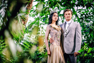 Smiling young couple in forest