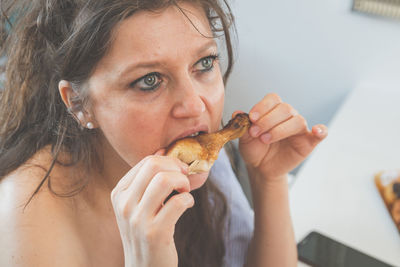 Portrait of woman eating food