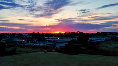 Landscape against sky at sunset