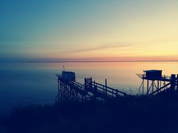 Scenic view of calm sea at sunset