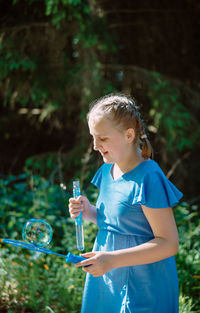 Girl blowing bubbles