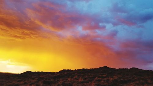 Low angle view of dramatic sky during sunset