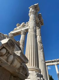 Low angle view of statue against blue sky