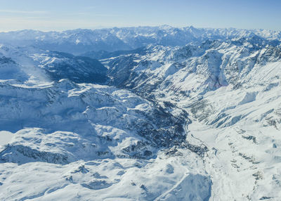 Close-up of snow covered mountain against sky