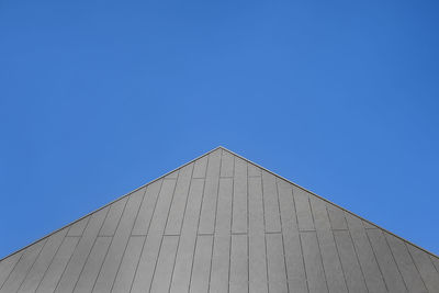 Low angle view of building against blue sky