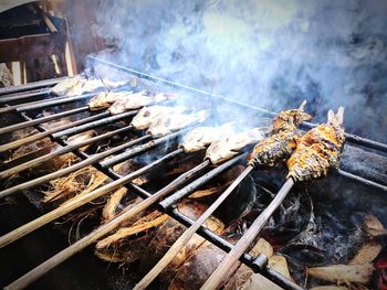 Close-up of meat on barbecue grill