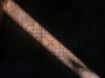 High angle view of person shadow on floor