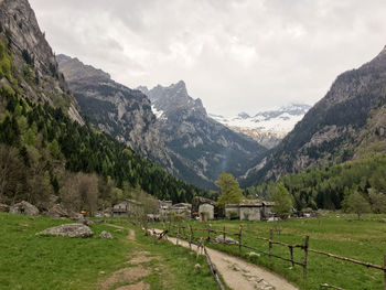 Scenic view of mountains against cloudy sky