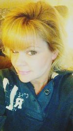 Close-up portrait of smiling young woman