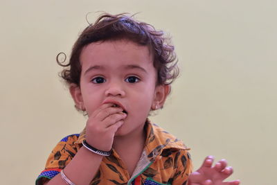 A child eating at home, indoors portrait