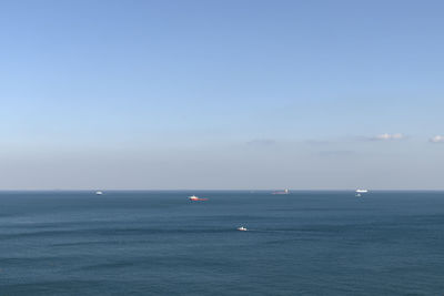 Scenic view of sea against clear blue sky
