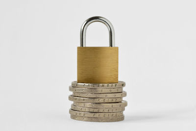 Close-up of padlocks against white background