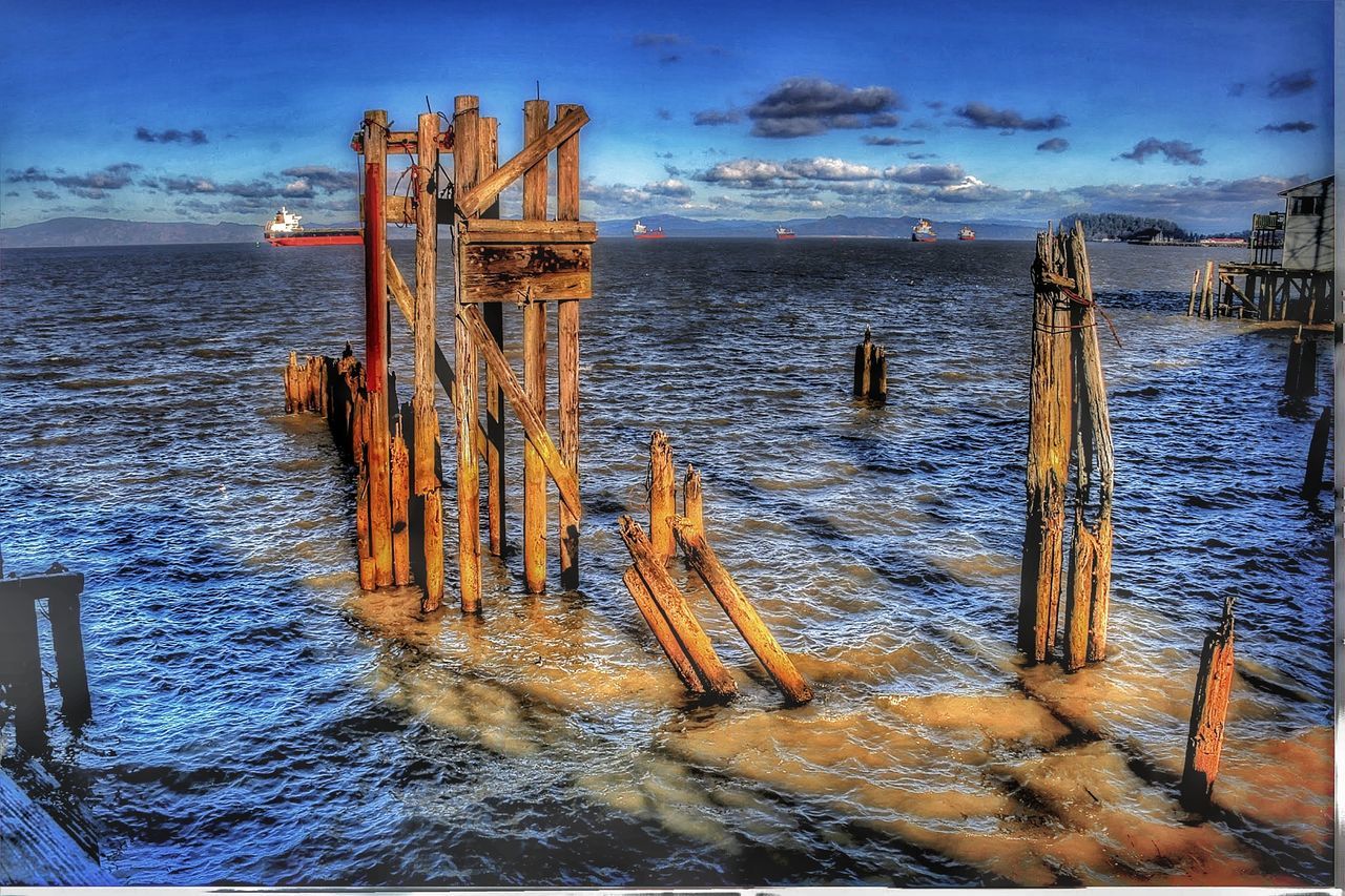 water, sea, sky, cloud - sky, wood - material, horizon, horizon over water, nature, beauty in nature, post, tranquility, no people, scenics - nature, wooden post, tranquil scene, beach, land, obsolete, built structure