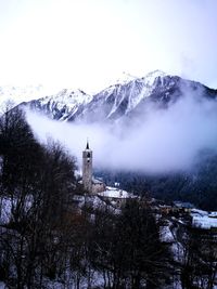 Scenic view of snowcapped mountains against sky