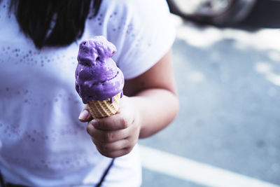 Cropped image of hand holding ice cream