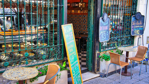 High angle view of empty chairs and tables in restaurant