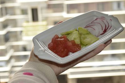 Close-up of hand holding ice cream