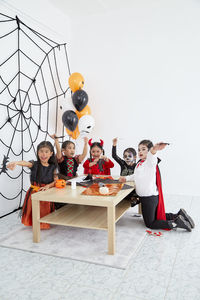 Group of people sitting on table