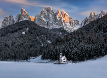 Snowy dolomites view during sunset