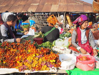 People looking at market stall