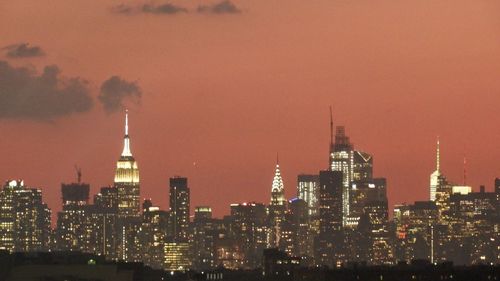 Illuminated buildings in city at night