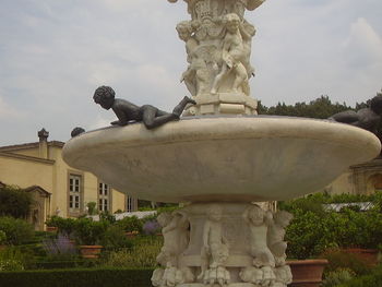 Low angle view of statue against sky