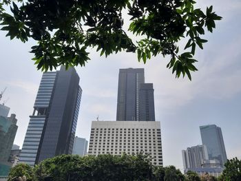 Low angle view of modern buildings against sky