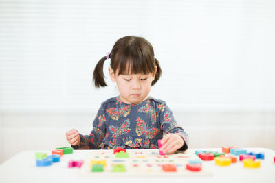 Portrait of girl looking at table