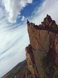 Low angle view of rock formations against sky