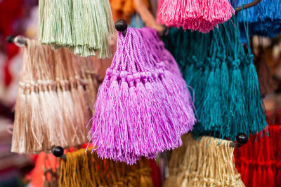 Close-up of multi colored decoration hanging for sale in market